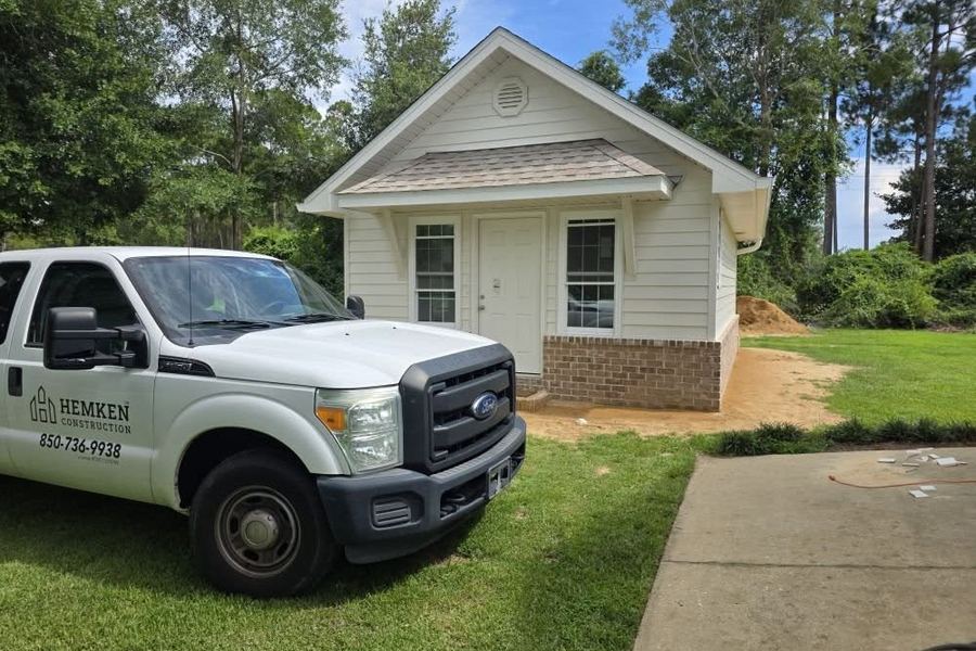 Hemken Construction work truck parked at a finished new build