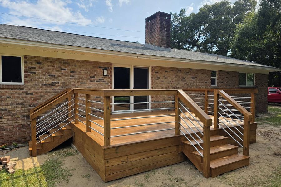 Deck stairs and cable railing detail from the yard side