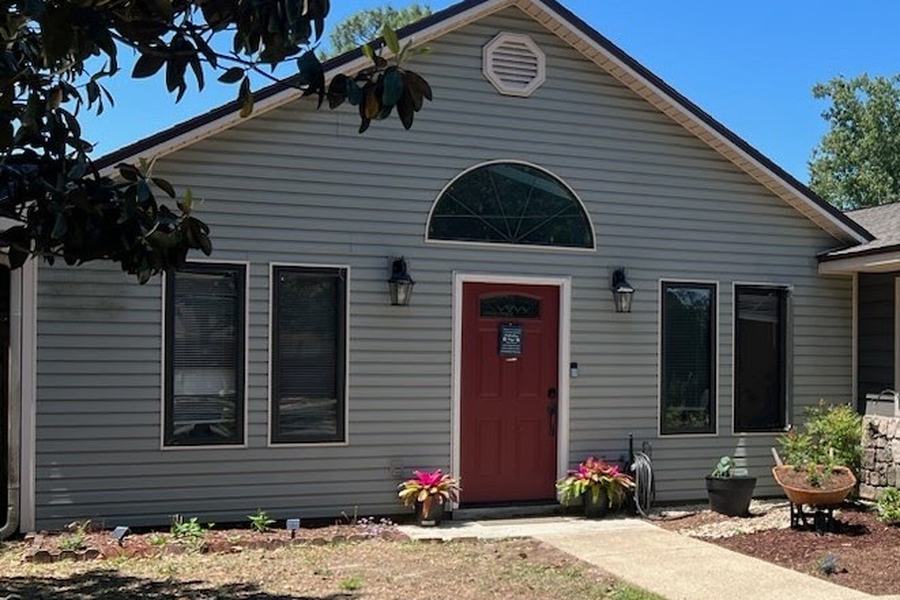 The same house before, with grey lap siding