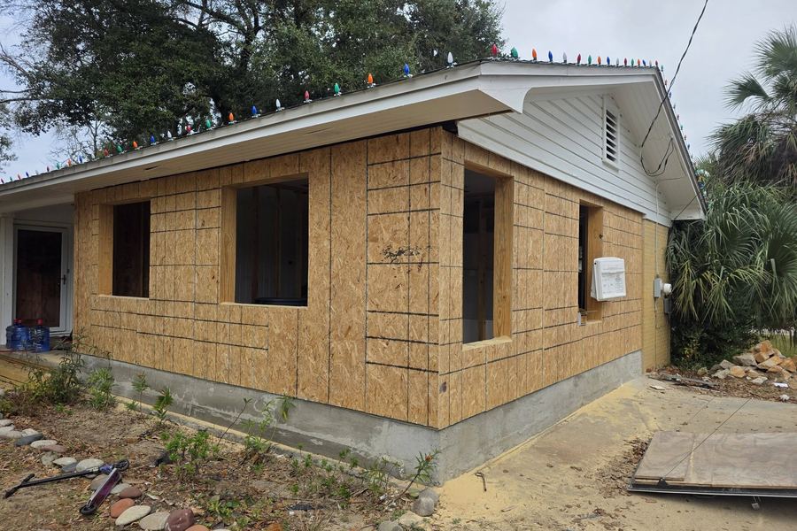 The same addition sheathed in OSB before the siding went on